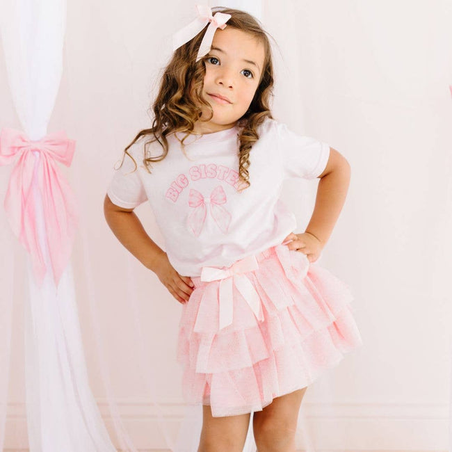 Secure hair clip backing on the Sweet Wink Coquette Satin Bow Clip.