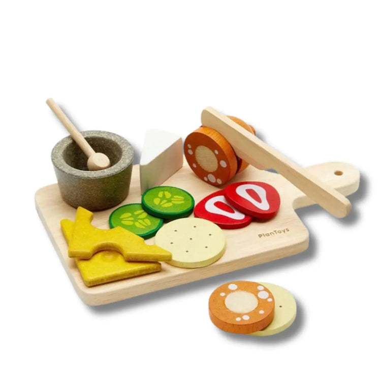 PlanToys Cheese & Charcuterie Board, wooden play set with brie, gouda, salami, crackers, and cutting board on a white background