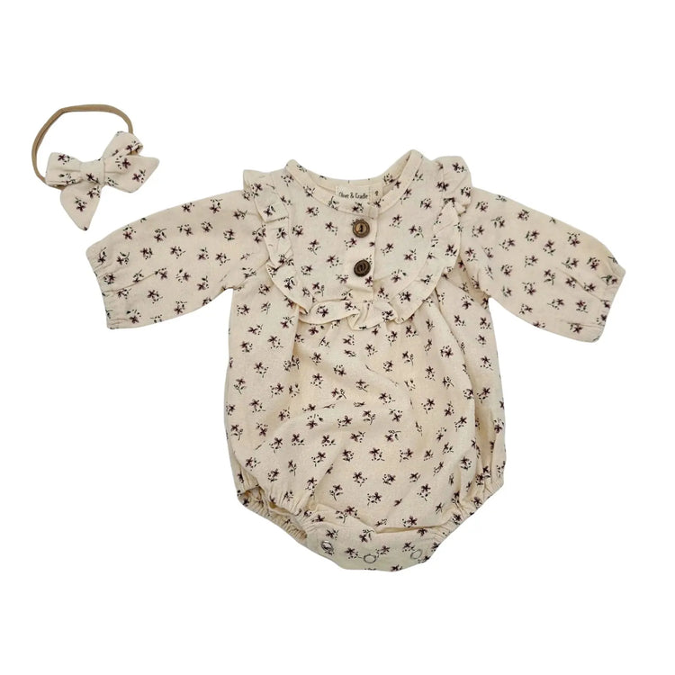 
                    
                      Floral baby girl romper with soft ruffles, coordinating bow headband and socks, comfortable everyday outfit
                    
                  
