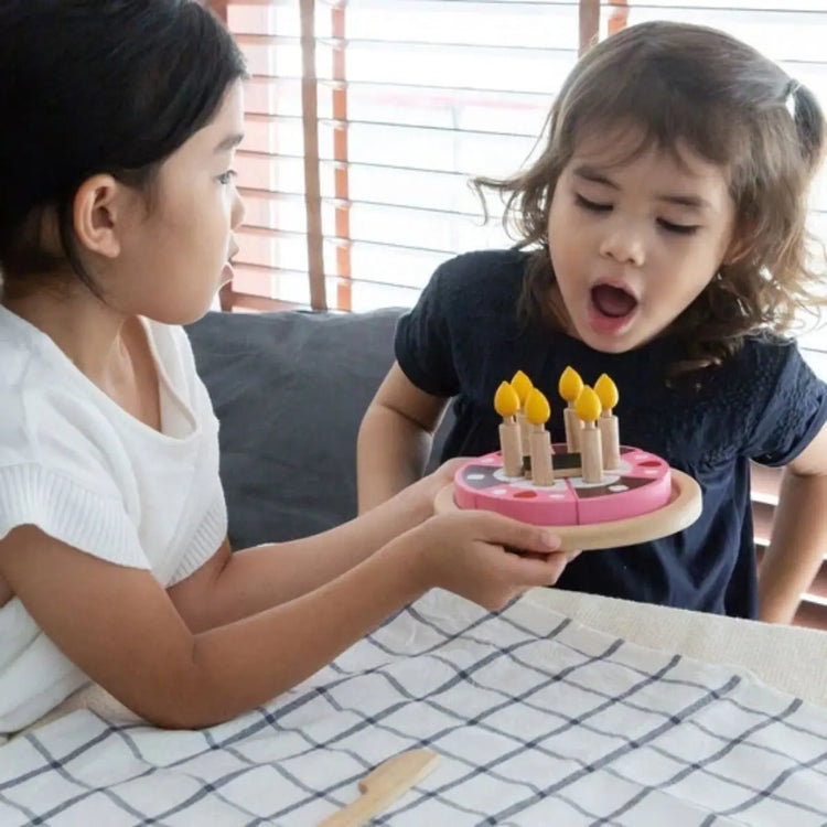 
                    
                      PlanToys Birthday Cake Set, wooden play cake with six slices, candles, knife, and chocolate bar nameplate on a white background
                    
                  