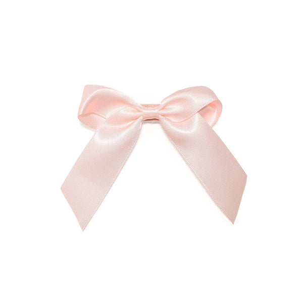 Close up of the luxurious satin fabric on the Sweet Wink Coquette Satin Bow Clip.