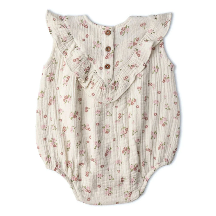 Organic Cotton Sleeveless Ruffle Bubble Romper - Blush Floral, baby girl wearing romper, front view showing relaxed bubble fit and ruffle detail
