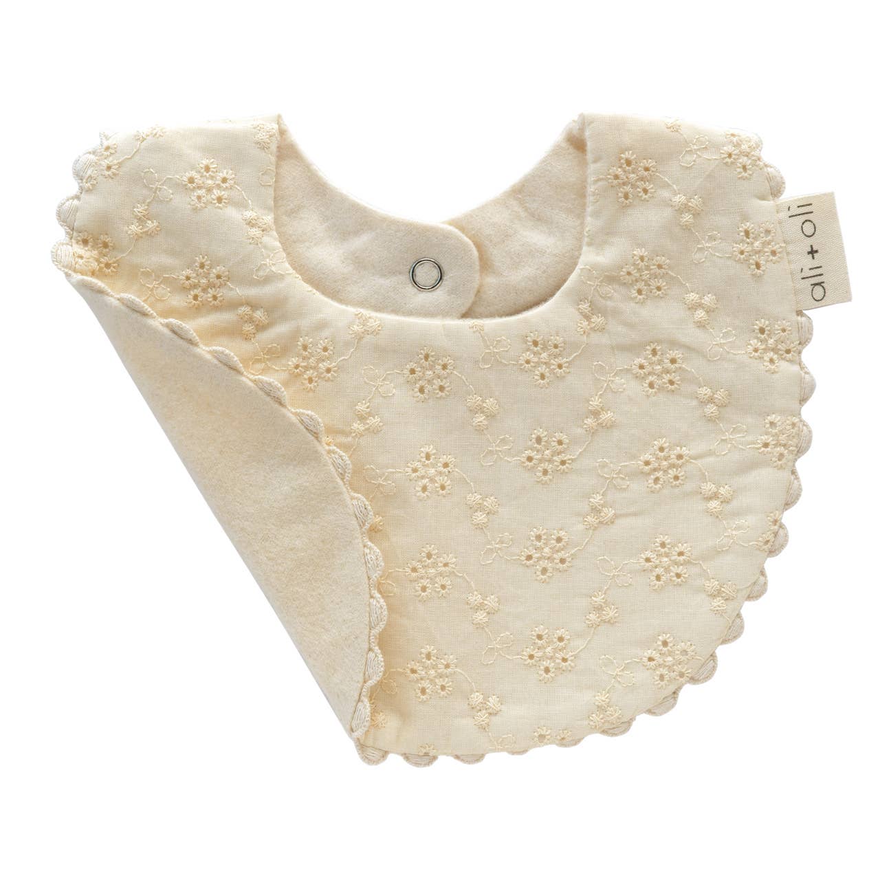 Close-up of eyelet flower detail on Muslin Eyelet Flowers Bib for babies