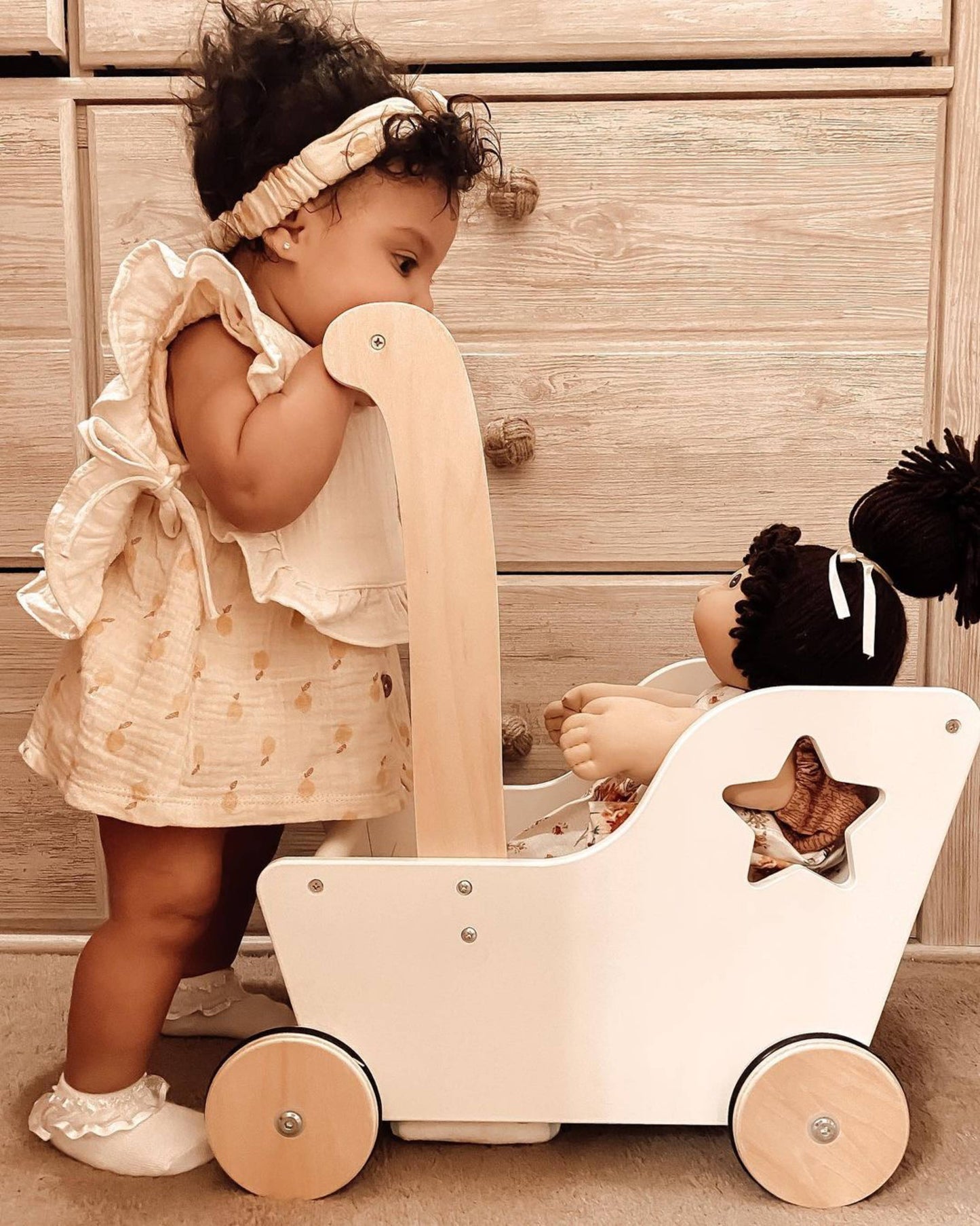 Flat lay of Muslin Cotton Ruffle Baby Bib with ruffle trim