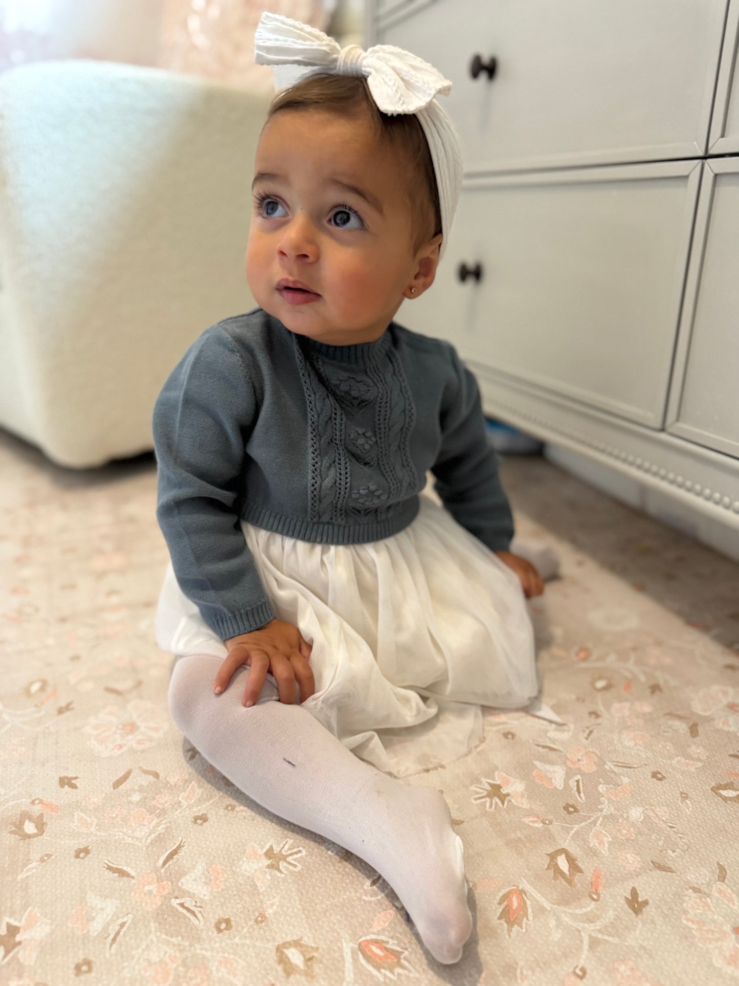 blues baby sweater dress on a baby girl