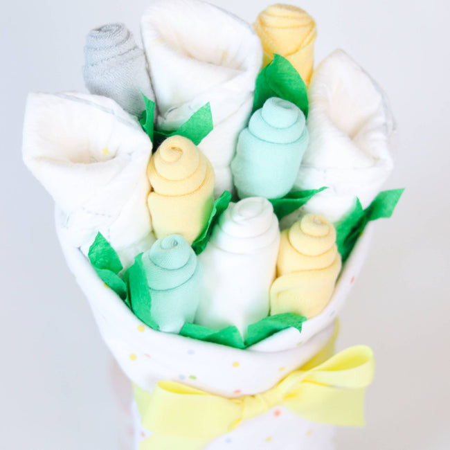 Neutral Dots Blossom Bouquet, gender-neutral baby gift bouquet handcrafted from diapers, socks, bodysuit, blanket, and washcloths in soft neutral dots