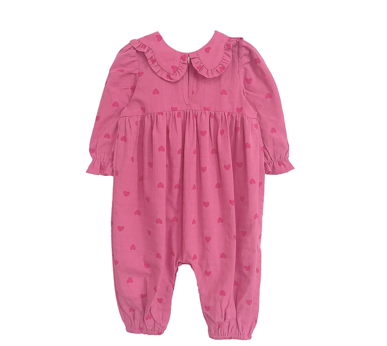 Close-up ruffle details on pink romper & headband set — easy snaps, gentle fabric for babies