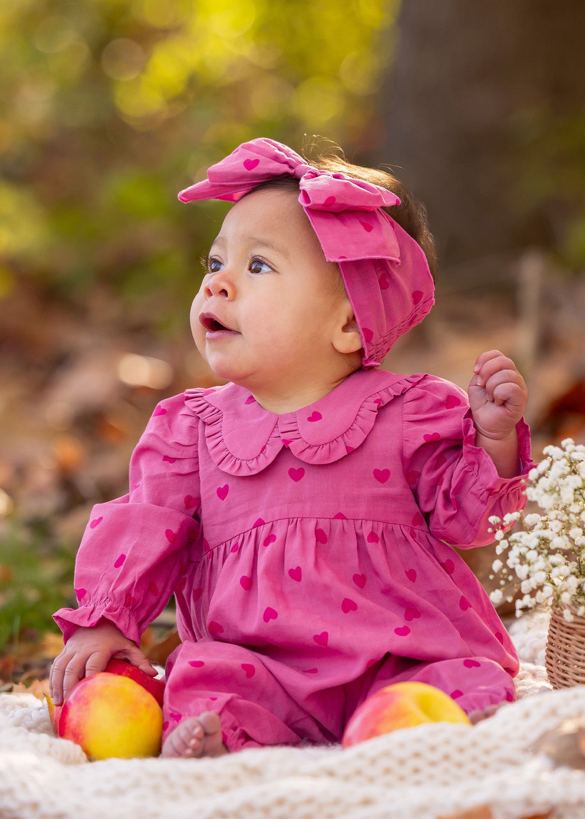 Toddler in pastel pink romper & headband set — picture-ready matching outfit for playdates