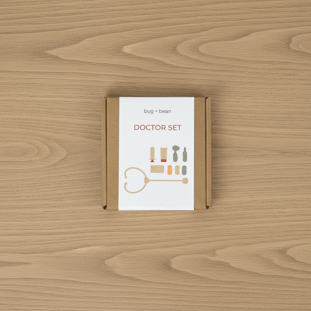 Silicone doctor play set toy laid out on soft linen surface – Montessori learning toy.