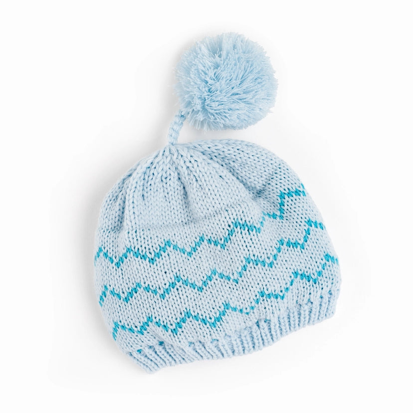 Close-up of Chill Cutie Hat showing pompom and geometric zigzag knit