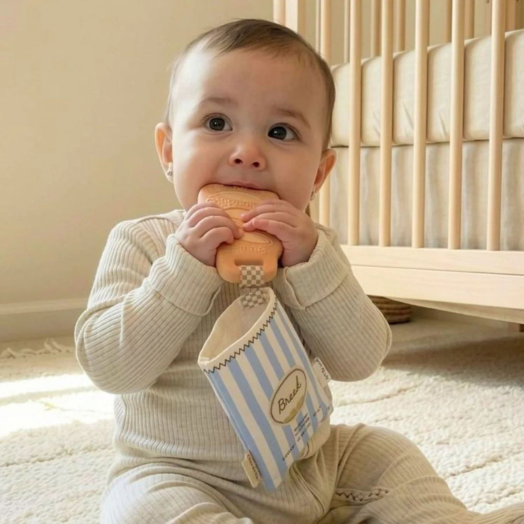 
                    
                      Itzy Ritzy Teensy Crinkle baby teether in baguette shape with silicone and crinkle fabric for babies 3 months and up
                    
                  