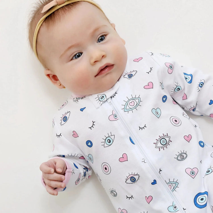 Girl Evil Eye Zipper Footie made from soft Pima cotton designed as a baby girl footed sleeper