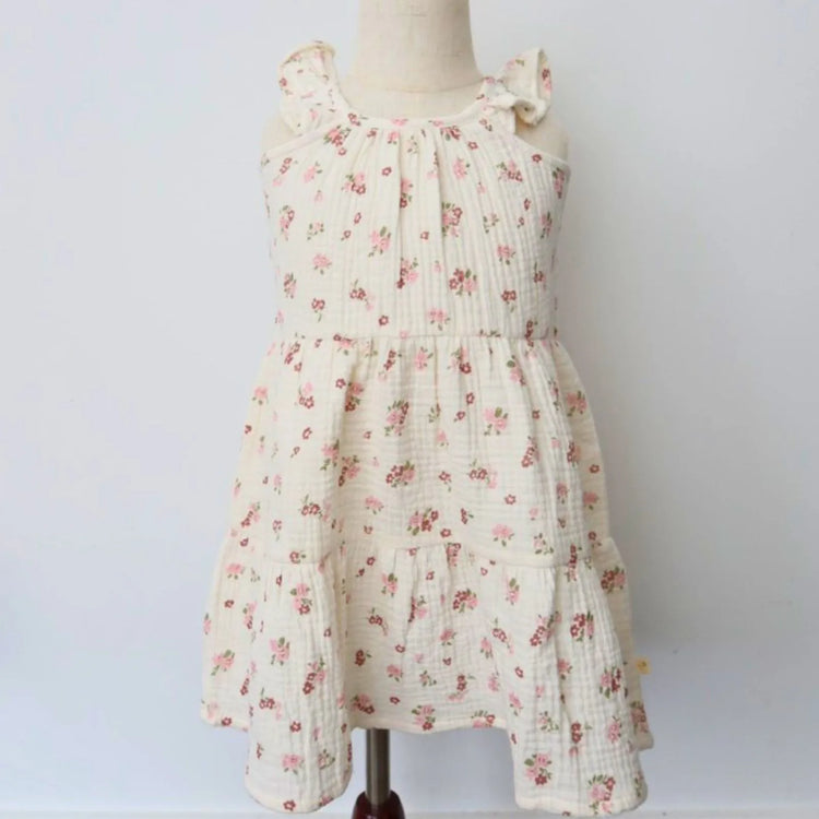 
                    
                      Organic Cotton Ruffle Tiered Dress - Blush Floral, toddler girl wearing dress, front view showing twirl-ready tiered skirt and relaxed summer fit
                    
                  
