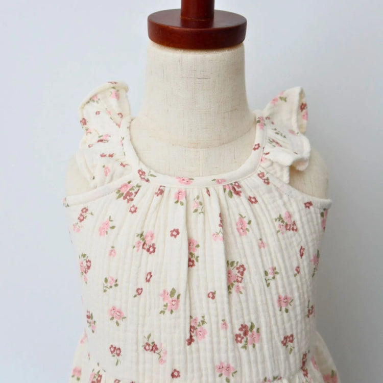 
                    
                      Organic Cotton Ruffle Tiered Dress - Blush Floral, toddler girl wearing dress, front view showing twirl-ready tiered skirt and relaxed summer fit
                    
                  