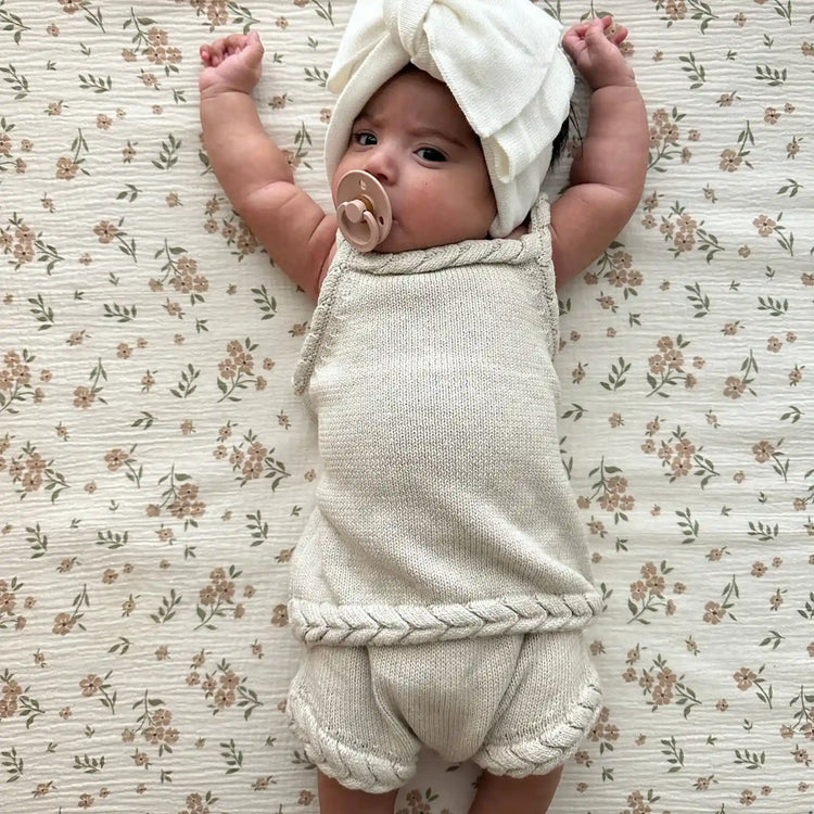 
                    
                      Shop the Braided Tank and Bloomers Set an 100% organic cotton baby two-piece set with braided tank detailing and matching bloomers.
                    
                  