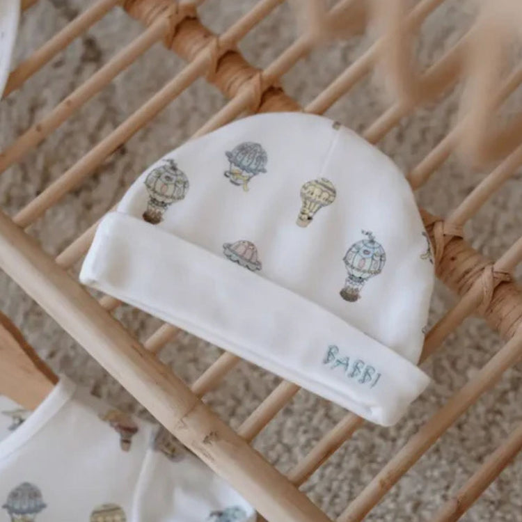 
                    
                      3-Piece Newborn Set - Cappadocia - Atelier Babbi Cappadocia print newborn set styled on soft background
                    
                  
