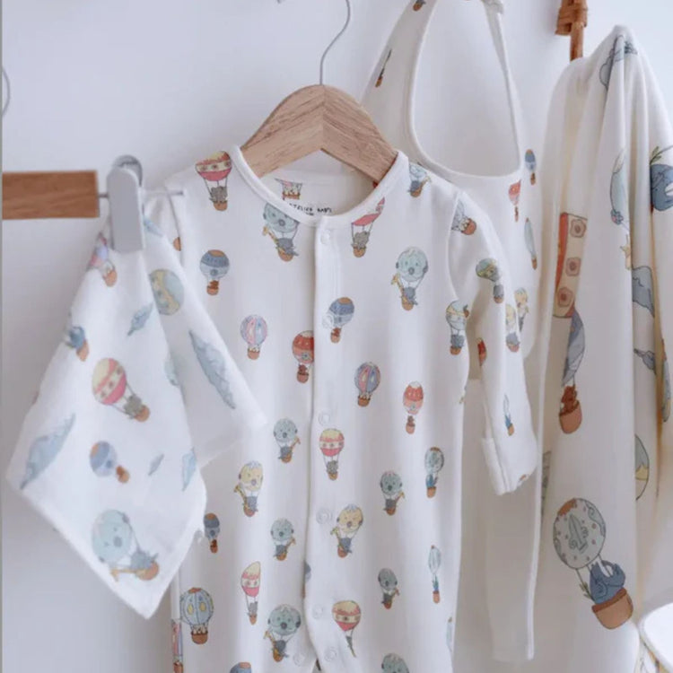 
                    
                      4-Piece Newborn Set - Cappadocia - close-up of hot air balloon print on cotton baby jumpsuit, 0-3 months
                    
                  