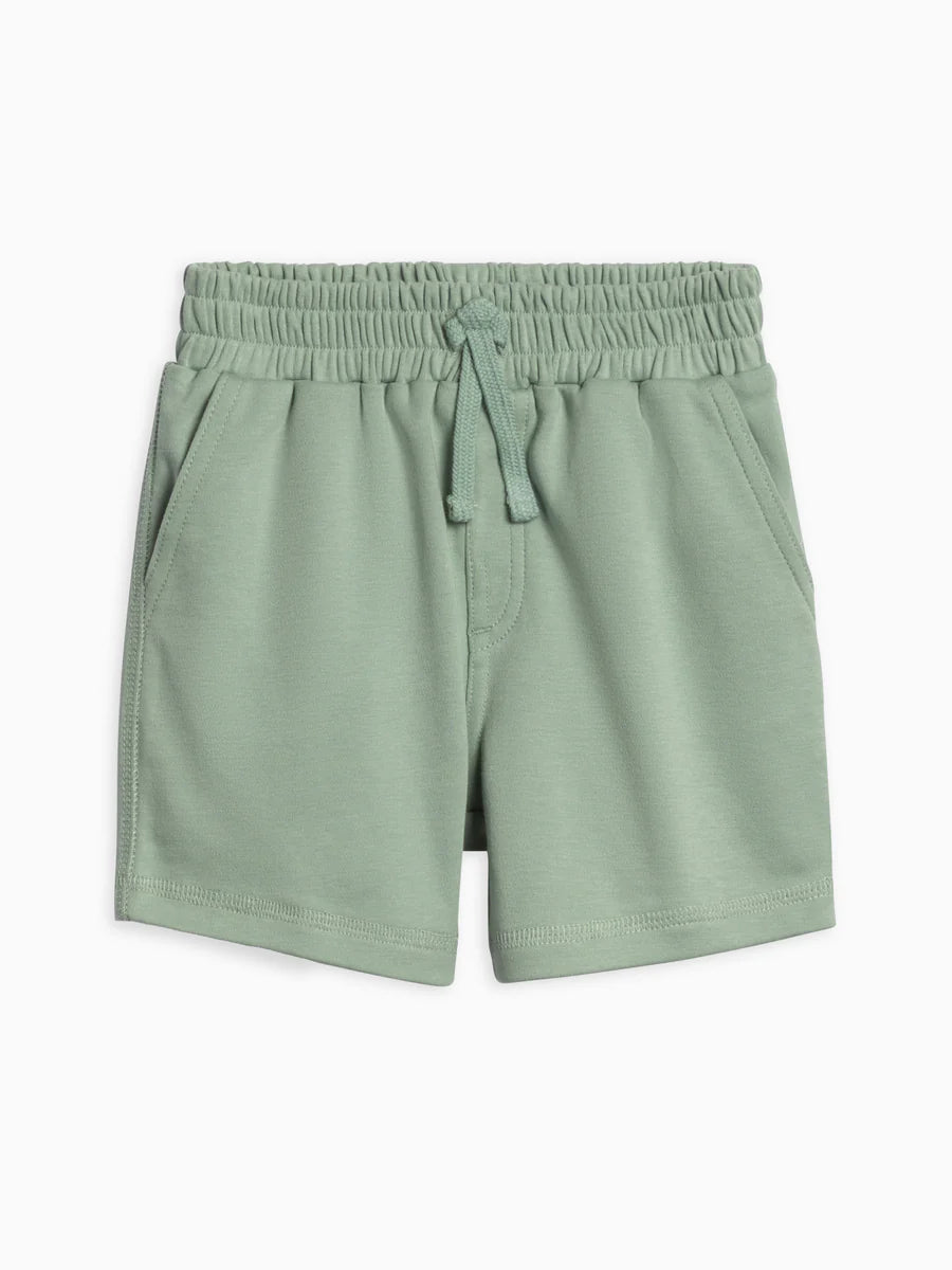 Green shorts with an elastic waistband on a white background