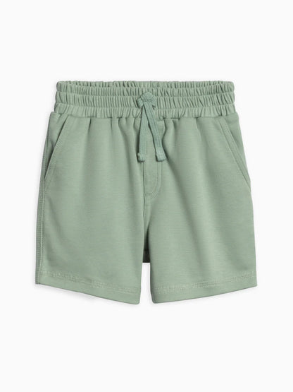 Green shorts with an elastic waistband on a white background