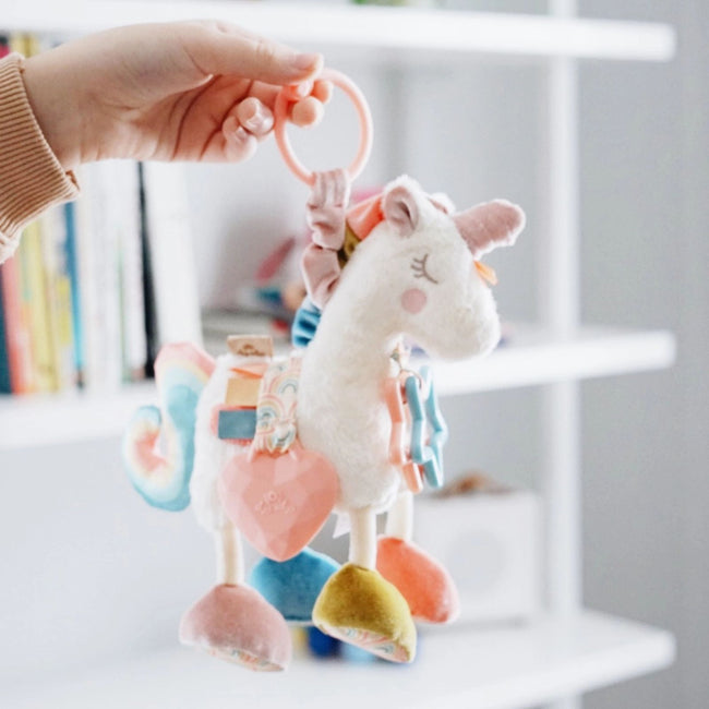 Link & Love Activity Toy (Unicorn), Itzy Ritzy natural cotton unicorn sensory toy with jingle, clinking rings, and textured ribbons