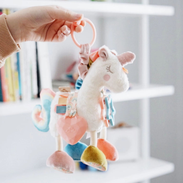 Link & Love Activity Toy (Unicorn), Itzy Ritzy natural cotton unicorn sensory toy with jingle, clinking rings, and textured ribbons