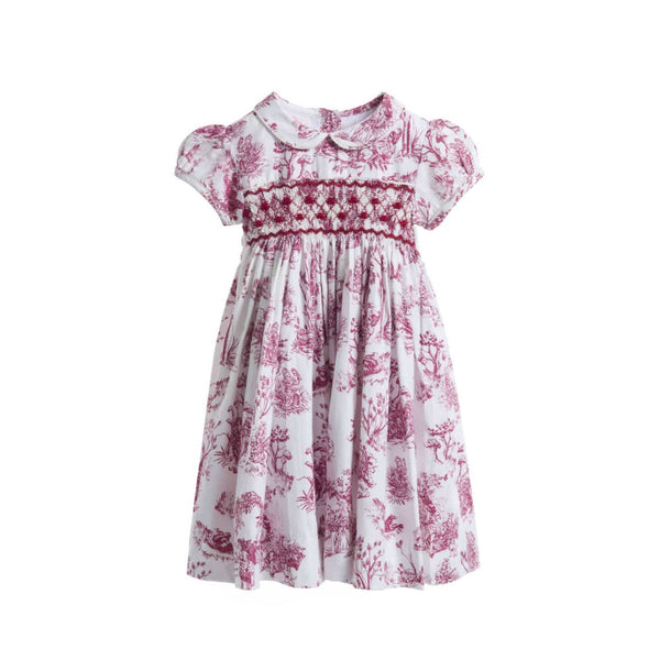 Philomena Smocked Toile de Jouy Dress - Burgundy / White, front view showing hand smocked bodice and puffed cap sleeves