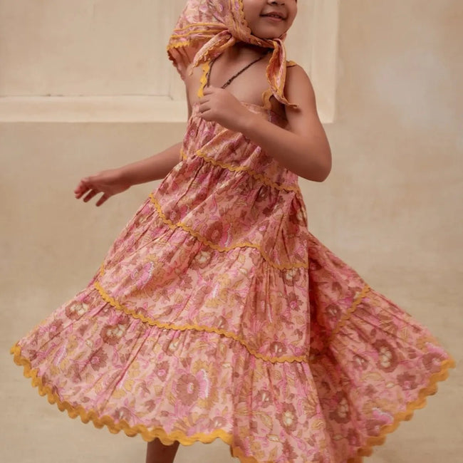 Pastel Pink Tiered Dress - front view on toddler girl